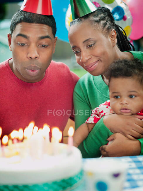 Parents with baby boy at birthday party — Stock Photo