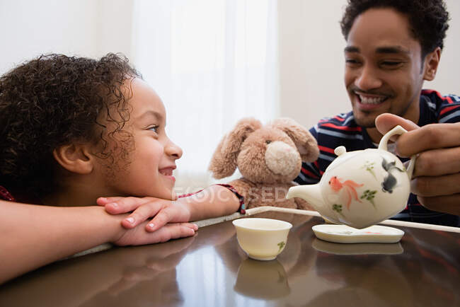 Father and daughter playing — Stock Photo
