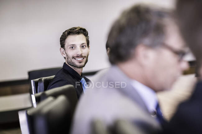 Happy businessman in board meeting — Stock Photo