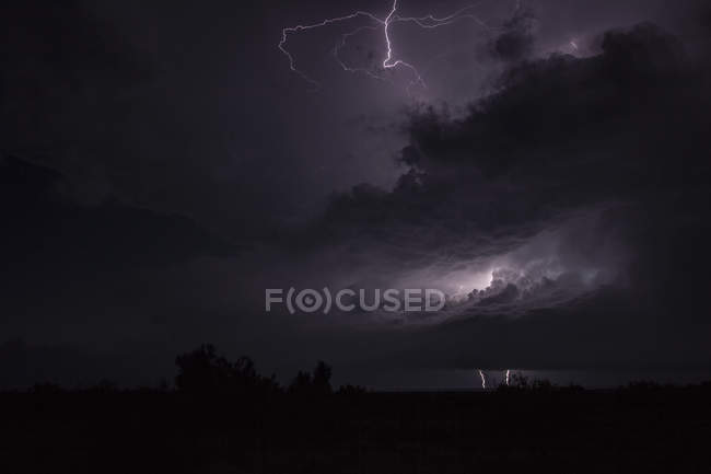 Night time tornadic thunderstorm generating multiple types of lightning — Stock Photo