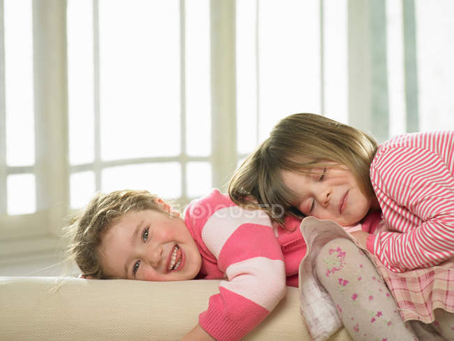 Girls playing together indoors — Stock Photo