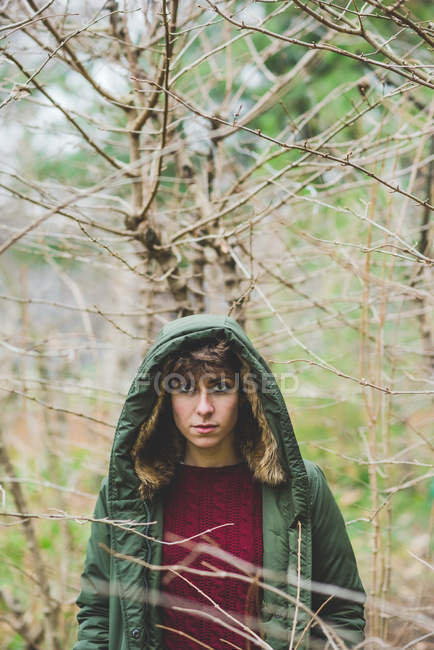 Portrait of young woman out doors wearing hooded coat — Stock Photo