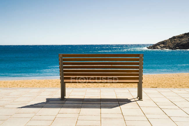 Empty Bench on shore — Stock Photo