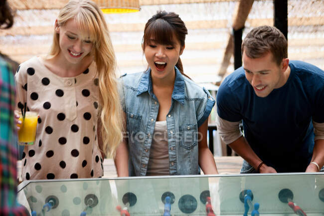 Friends playing table football — Stock Photo