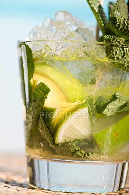 Close up shot of mojito cocktail in glass — Stock Photo