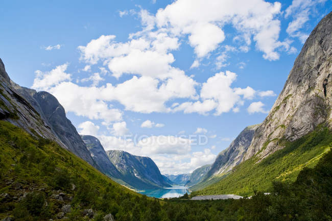 Mountains and lake kjosnesfjorden under cloudy sky — Stock Photo