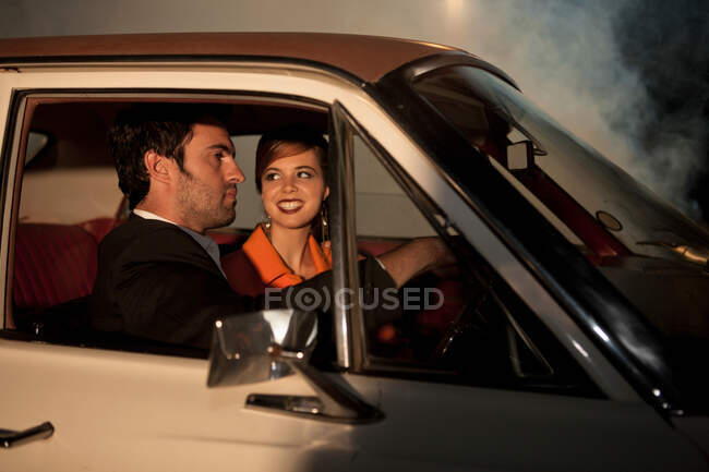 Couple driving together at night — Stock Photo