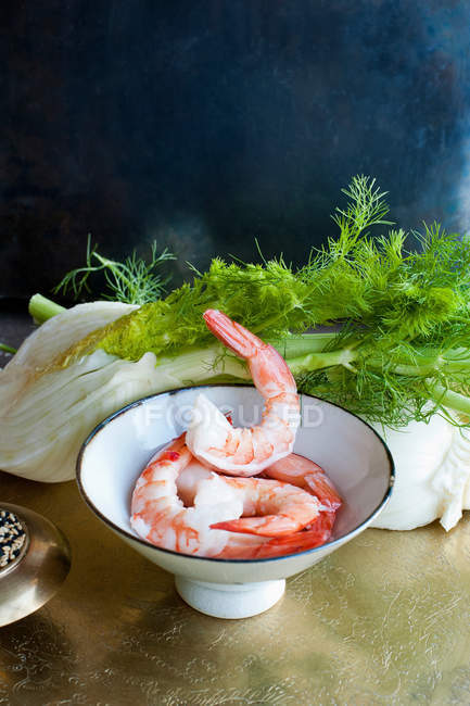 Bowl of prawns and herbs — Stock Photo