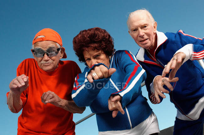 Three elderly people posing as youth — Stock Photo