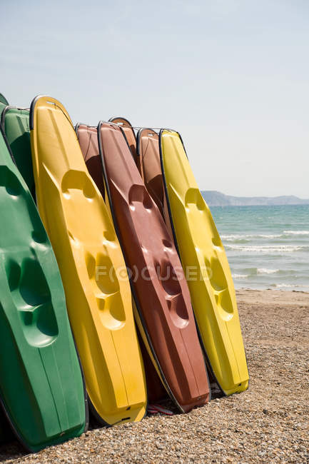 Kayaks on weymouth beach — Stock Photo