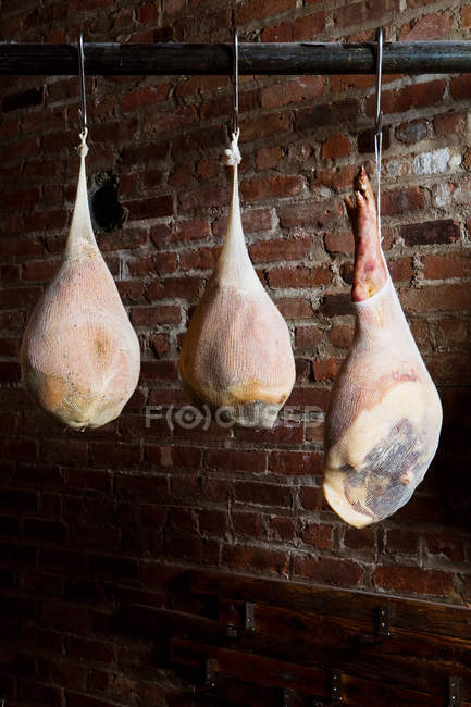 Dry cured prosciutto hams — Stock Photo