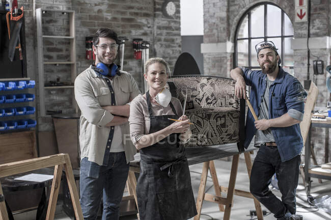 Cape Town, South Africa, three so workers standing together in workshop — Stock Photo