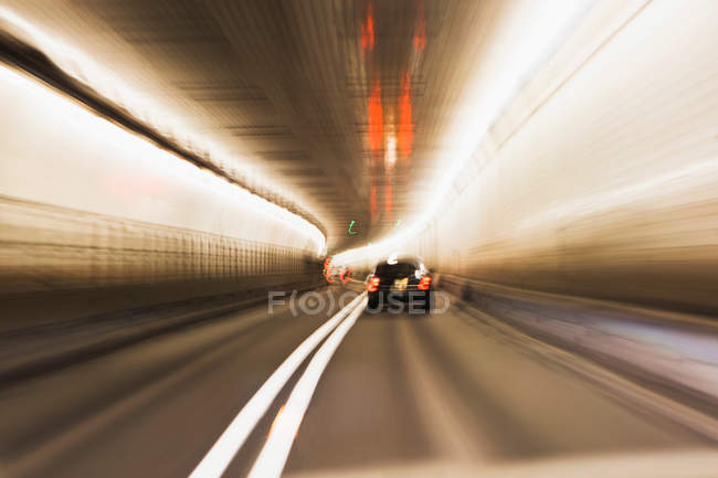 Moving cars lights in tunnel, long esxposure shot — Stock Photo