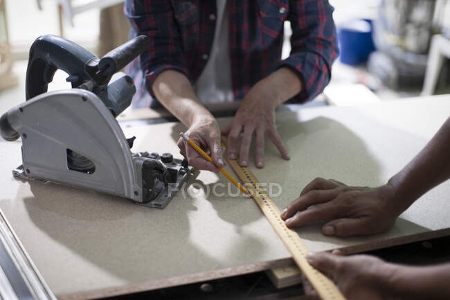 Cape Town, South Africa, woman using wooden ruler — Stock Photo