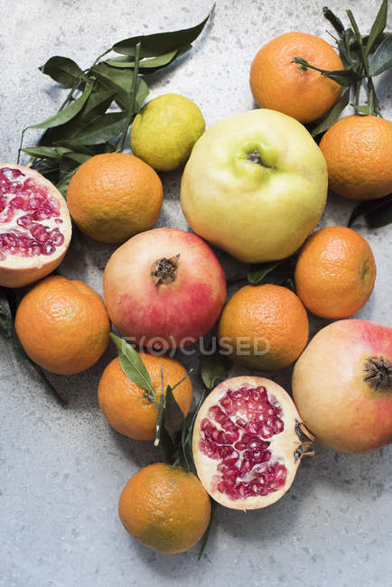 Top view of colourful fruit and halved pomegranate — Stock Photo