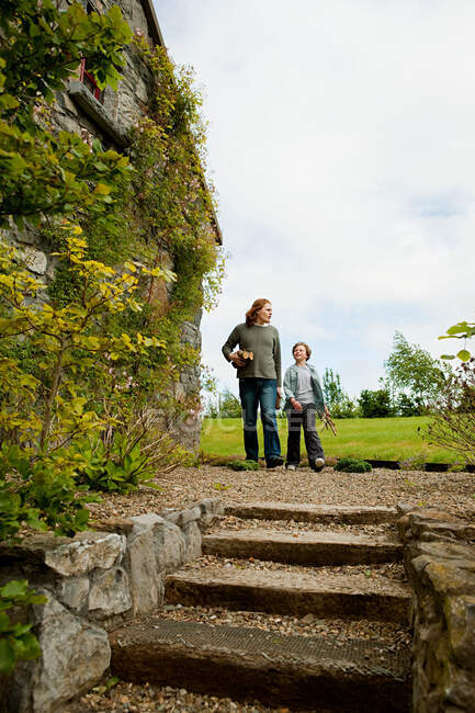 Father and son walking toward steps — Stock Photo