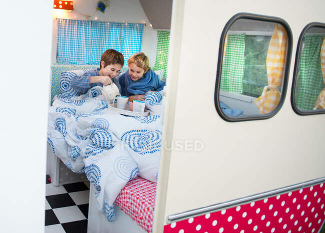 Children having breakfast in camper — Stock Photo