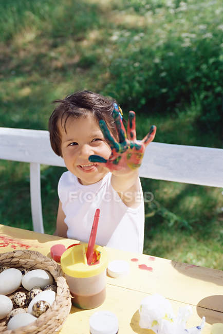Girl with paint on her hands — Stock Photo