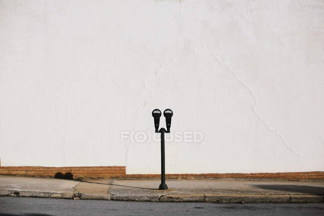 Parking meter on pavement — Stock Photo