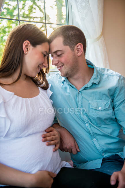 Pregnant woman face to face with partner — Stock Photo