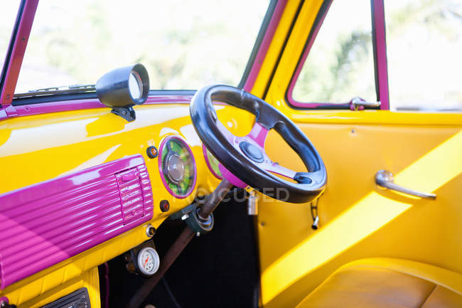 Steering wheel in colorful car — Stock Photo