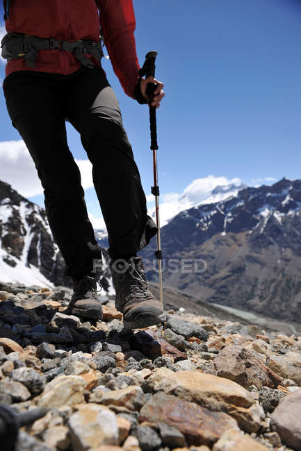 Woman navigates scree below the lookout point at Cerro Electrico, El Chalten, Argentina — Stock Photo