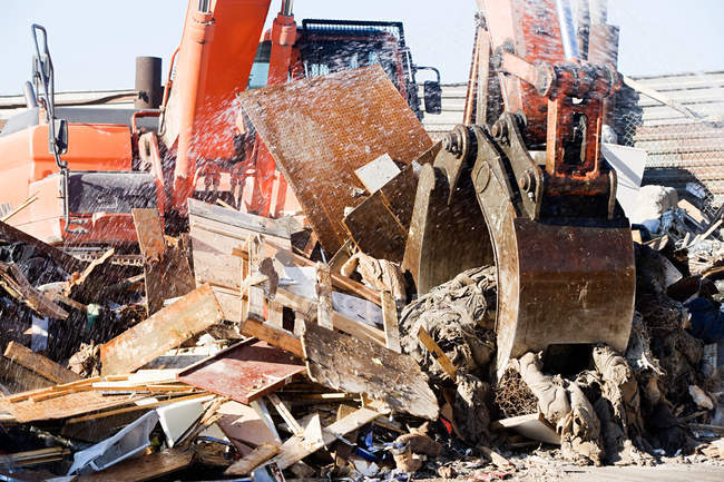 View of orange excavator at rubbish dump — Stock Photo