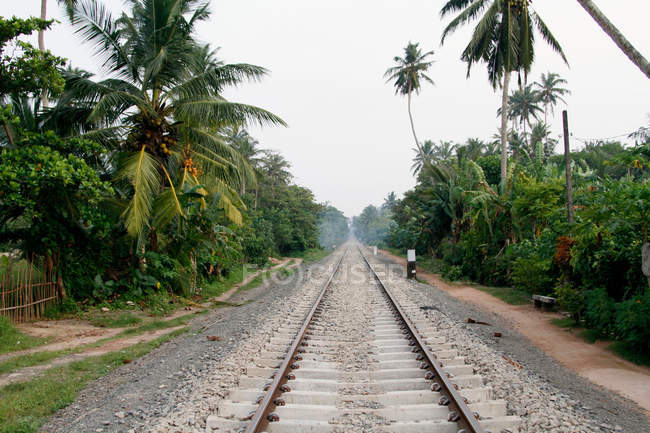 Train tracks on gravel road — Stock Photo