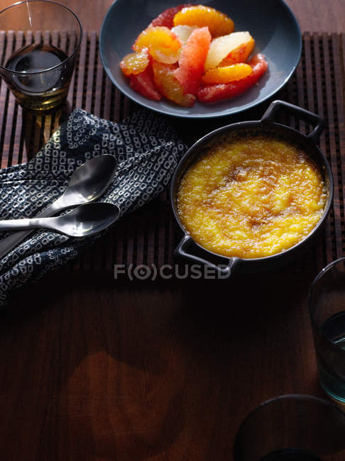 Dish of eggs with fruit pulp on plate — Stock Photo