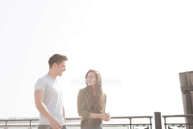 Young couple walking outdoors — Stock Photo