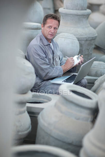 Dealing with sales in pottery factory — Stock Photo