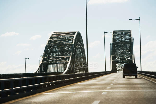 Van driving on bridge — Stock Photo