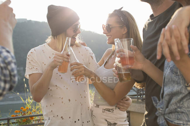 Adult friends at waterfront roof terrace party, Budapest, Hungary — Stock Photo