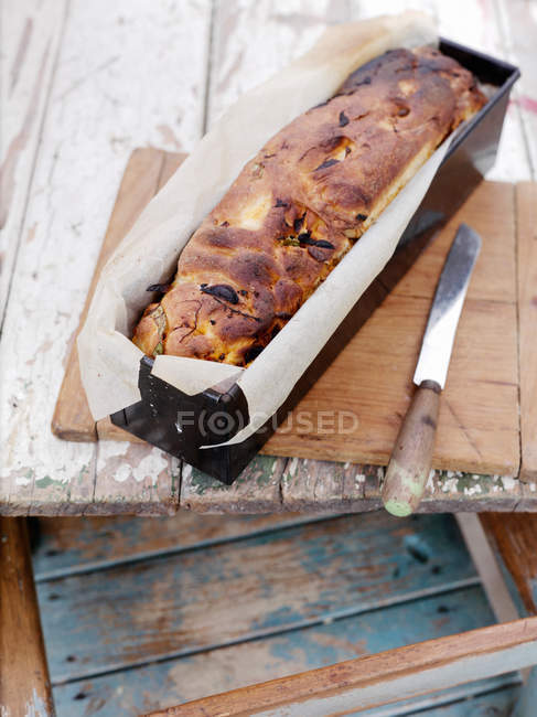 Loaf of bread on board — Stock Photo