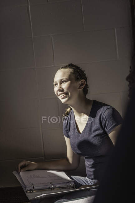 Teenage girl with file notes in high school study class — Stock Photo