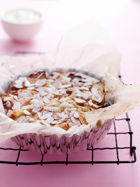 Close-up of pear and almond tart on rack — Stock Photo
