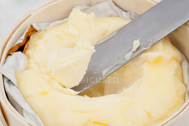 Knife in melting butter — Stock Photo