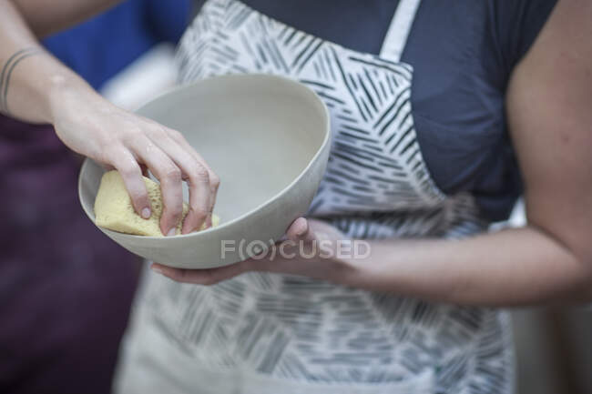 Cape Town, South Africa, moulding off clay bowl made in ceramic workshop — Stock Photo