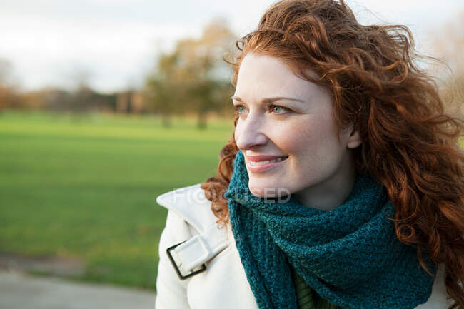 Portrait of a smiling red haired woman — Stock Photo