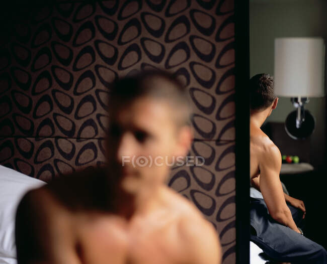 Young man reflected in mirror — Stock Photo