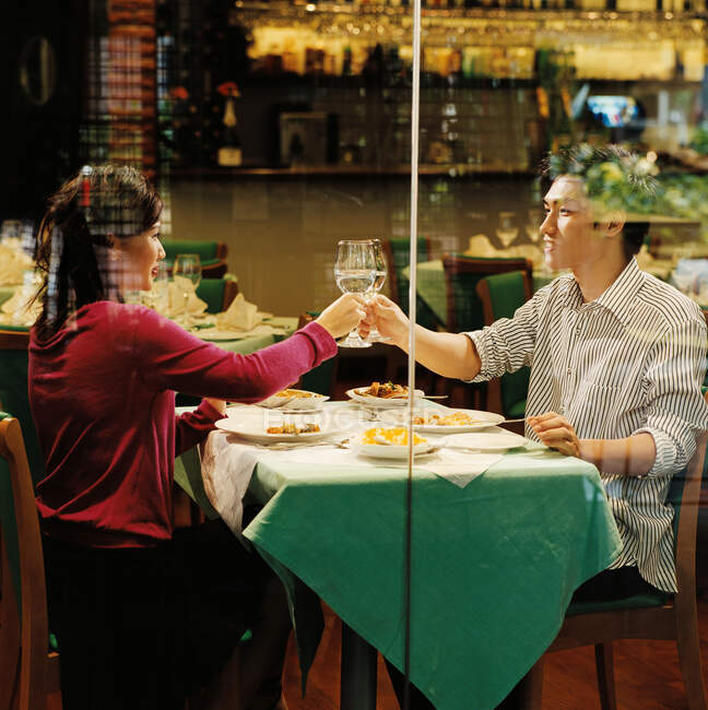 Young couple in restaurant — Stock Photo