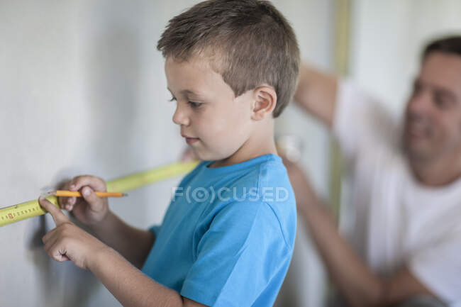 Cape Town, South Africa father and son renovating home together — Stock Photo