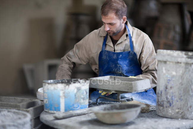 Sculpting and shaping pottery — Stock Photo