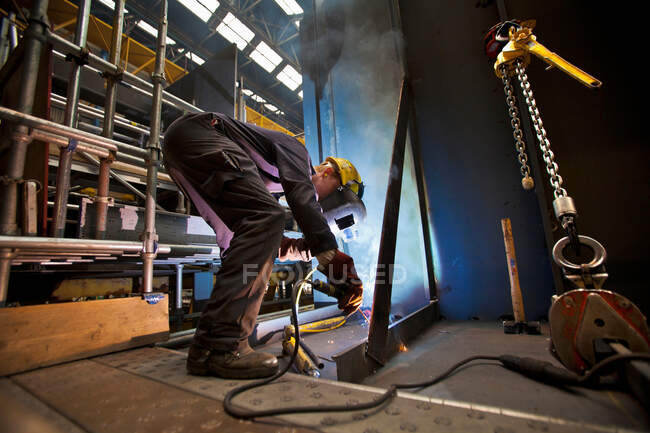 Welder at work in shipyard — Stock Photo