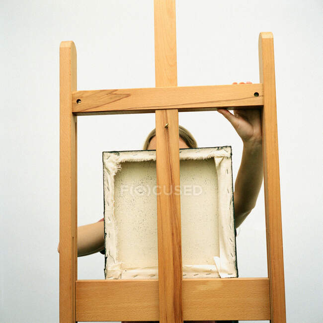 Artist with square picture frame — Stock Photo