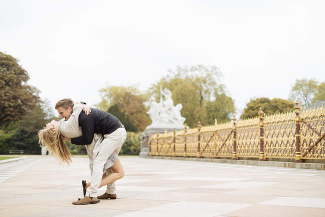 Romantic young couple bending over whilst hugging — Stock Photo