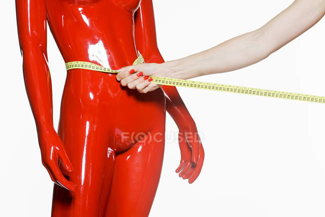 Tape measure around mannequin waist — Stock Photo