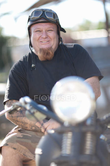 Man in vintage goggles on motorcycle — Stock Photo