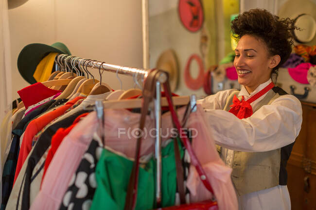 Woman shopping in clothes shop — Stock Photo