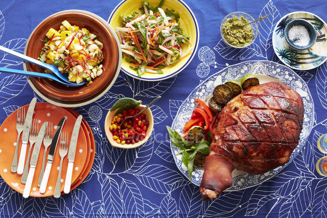 Still life of baked creole ham and side dishes — Stock Photo
